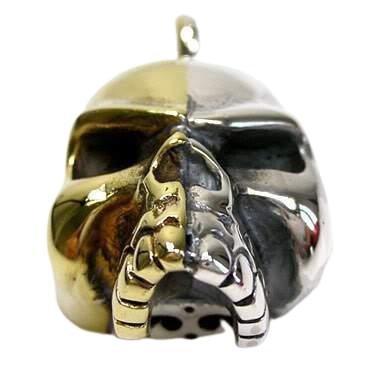 https://www.gothicrock.com/cdn/shop/products/14k-gold-skull-pendant-2_600x.jpg?v=1636444855