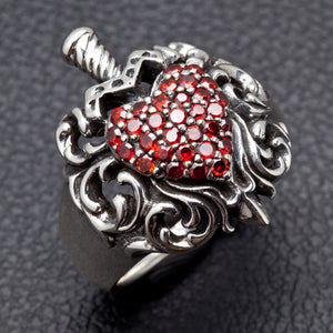 Garnet Heart Dagger Sterling Silver Ring — three-quarter view of dagger and scrollwork
