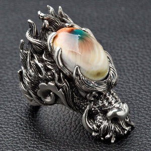 Shiva Shell Dragon 925 Sterling Silver Ring, right three-quarter view on dark surface