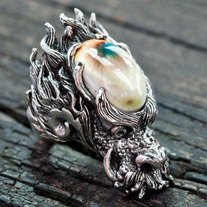 Shiva Shell Dragon 925 Sterling Silver Ring, dragon and oval Shiva shell at a right angle on wood