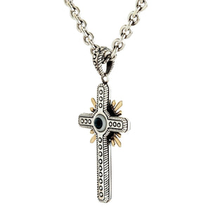 Sterling silver protection cross with blue eye detail suspended from a heavy patterned bail and thick cable chain.