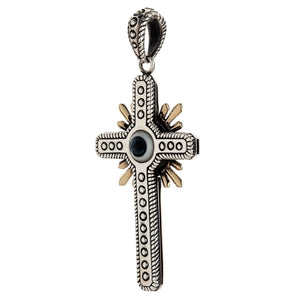 Side angle emphasizing the pendant's ornate patterned bail, thick sterling silver construction, and raised dot detailing.