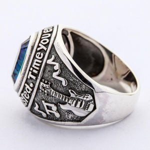 Guitar and musical notes engraved on Mystic Quartz ring shoulder