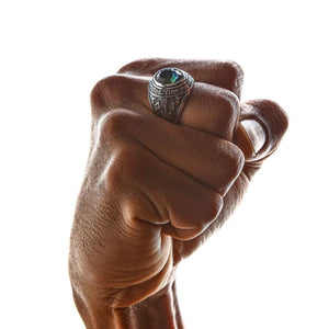 Mystic Quartz Union Jack ring worn on hand gripping leather loop