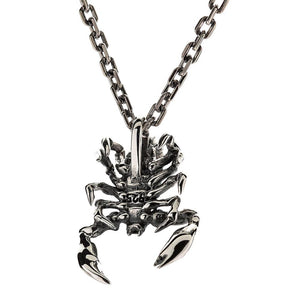 Small Scorpion Sterling Silver Pendant: Front view angled down of the sterling silver scorpion, claws spread and the tail arching into the suspension loop