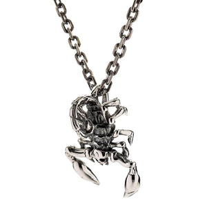 Small Scorpion Sterling Silver Pendant: The gothic scorpion pendant shown from the side while attached to a sterling silver chain to illustrate how it hangs