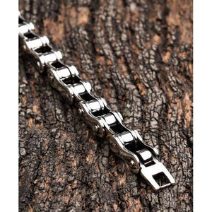Small Bike Chain Sterling Silver Bracelet, bike-chain plates and fold-over clasp on bark