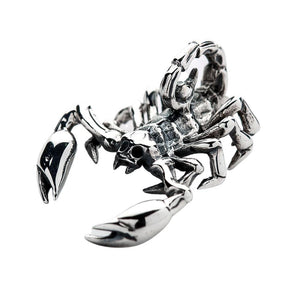 Small Scorpion Sterling Silver Pendant: An angled close-up of the solid silver scorpion pendant, showing its three-dimensional design and polished pincers